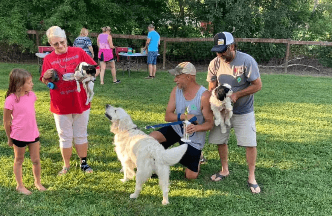 Family with their dog at the campground