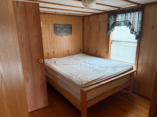 A made-up cabin bed at Country Acres